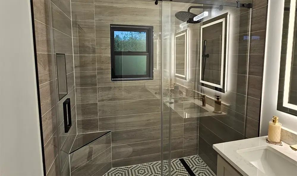 Remodeled bathroom with custom tile shower
